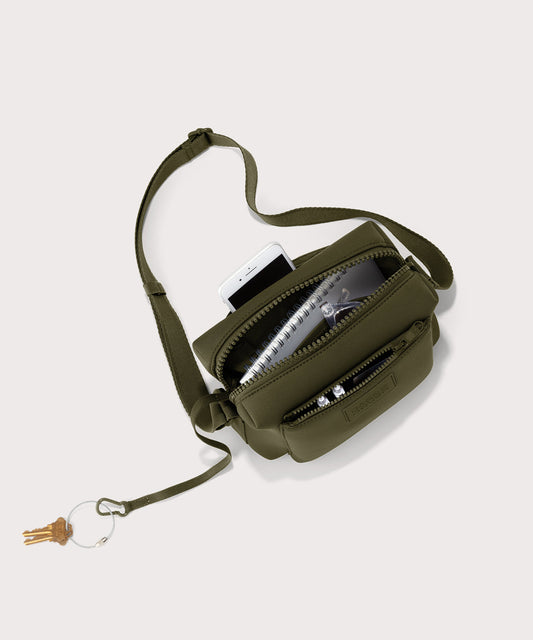 Dagne Dover Micah Crossbody in dark green seen from above, showing the interior air mesh pocket.