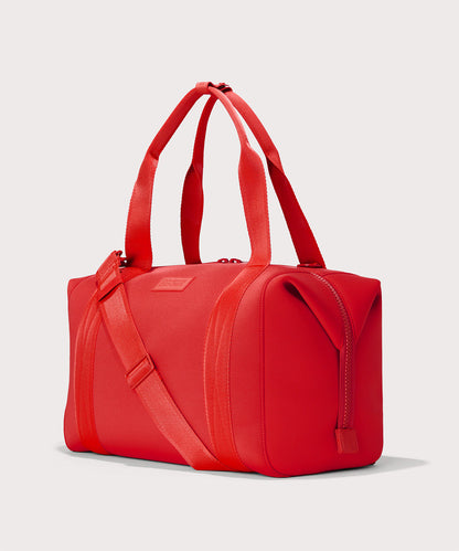 Dagne Dover Large Landon Carryall in a fiery, saturated red leaning toward orange seen from an angle.