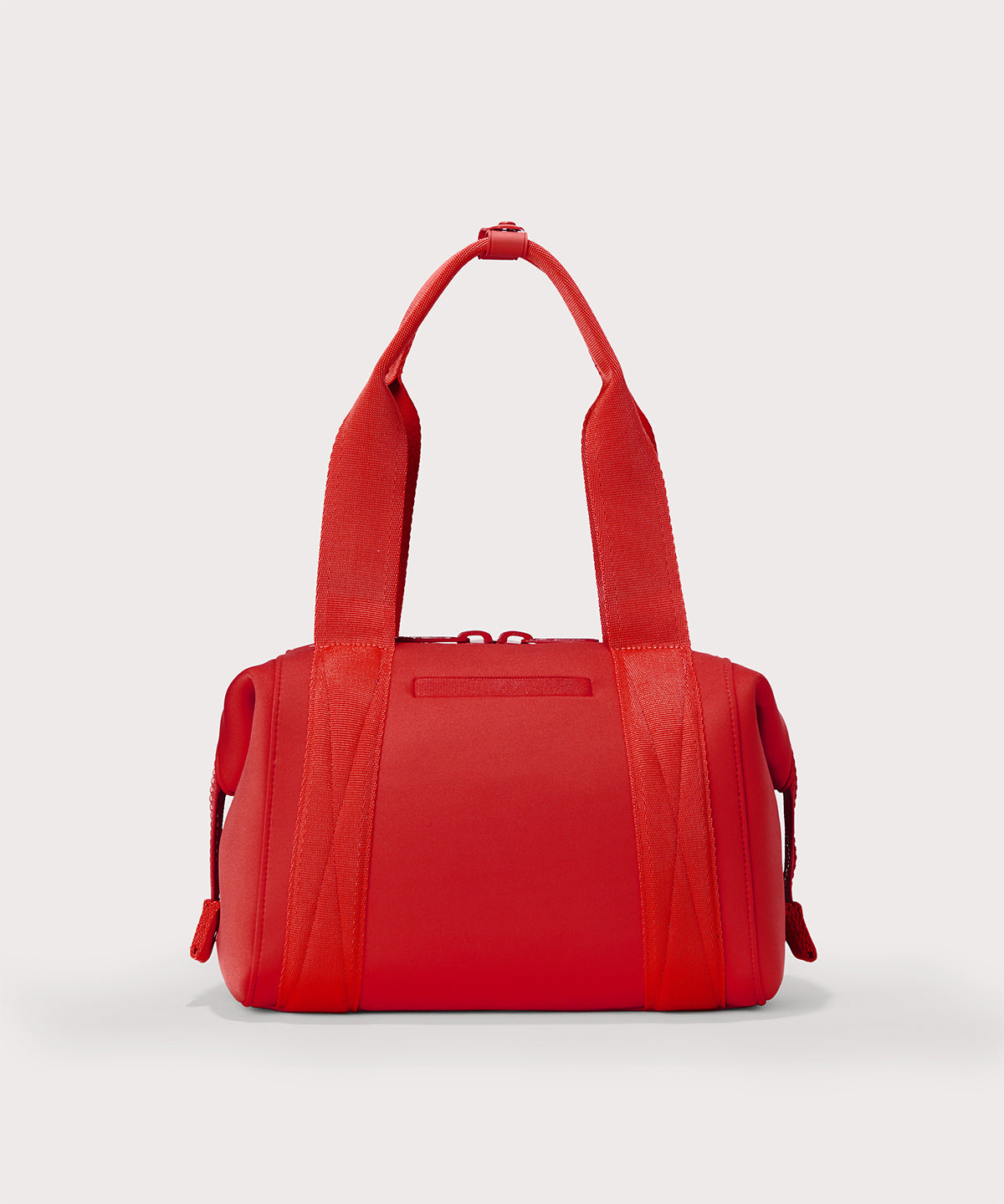Dagne Dover Small Landon Carryall in a fiery, saturated red leaning toward orange seen from the back.