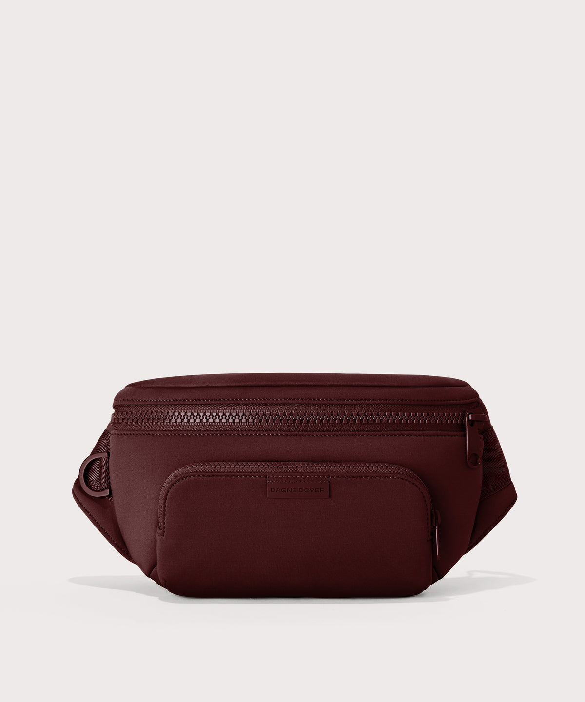Dagne Dover Jax Large Fanny Pack in a deep brown with purple undertones.