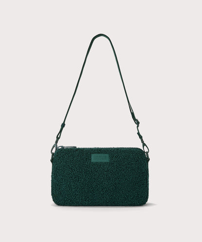 nora shoulder bag in a saturated, jewel-toned deep green with bold blue undertones. In a Faux Shearling a soft, wool-like plush made with recycled materials