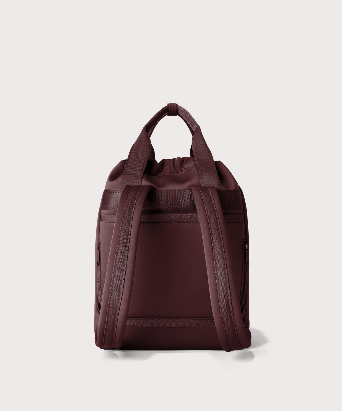 Rhys Backpack in a deep brown with purple undertones seen from the back.