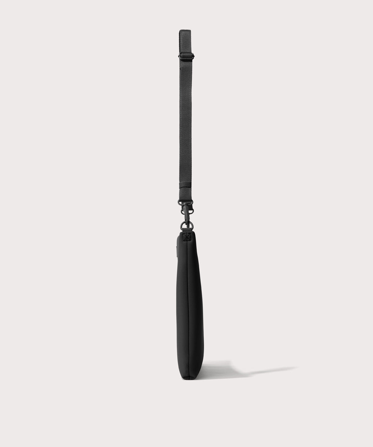 16 inch laptop shoulder bag in a black seen from the side view.