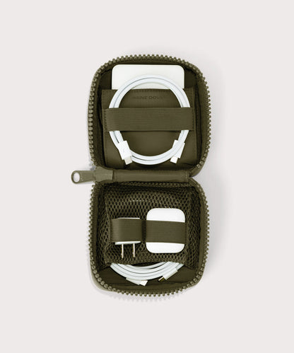 hover - Dagne Dover small Arlo Tech Organizer in dark green unzipped, revealing the interior elastic loops and airmesh pockets.