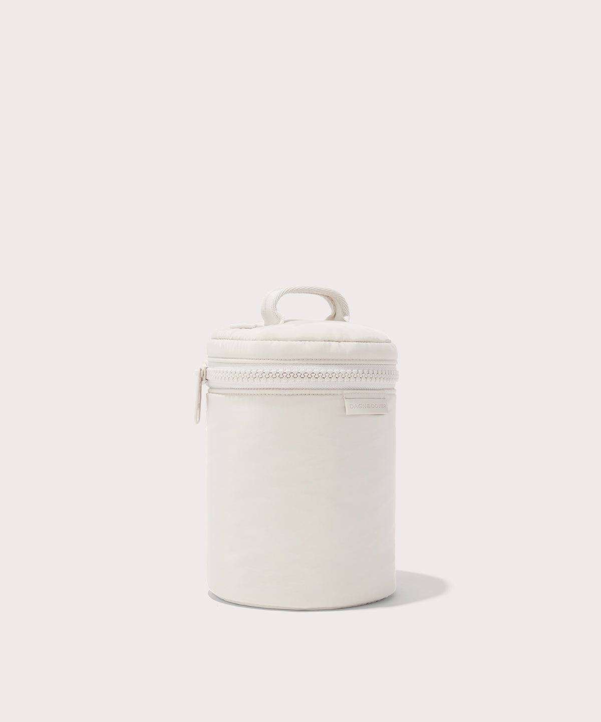 Dagne Dover large Mila Toiletry Pouch in white seen from an angle.