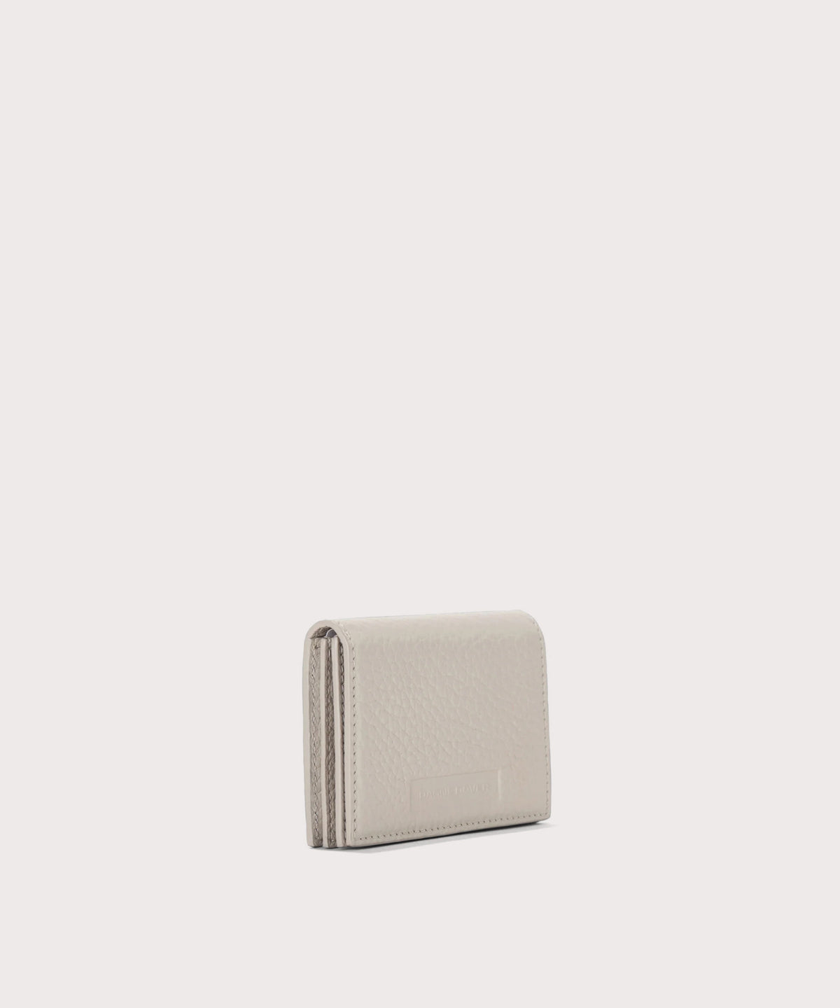 Dagne Dover Accordion Card Case in white seen from an angle.