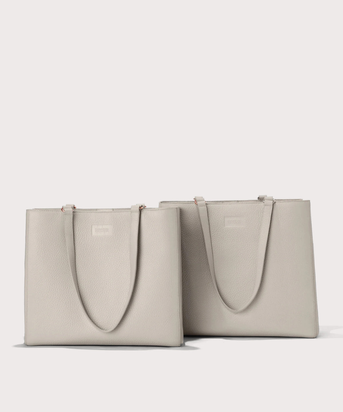 Dagne Dover medium and medium Allyn Totes in light grey.