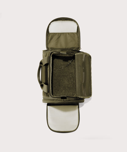 Dagne Dover Large Kyoto Pet Carrier in a deep olive green seen unzipped, top down view.