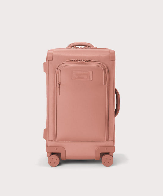 Front view of Seattle carry-on rolling luggage 23.5” in warm dust pink